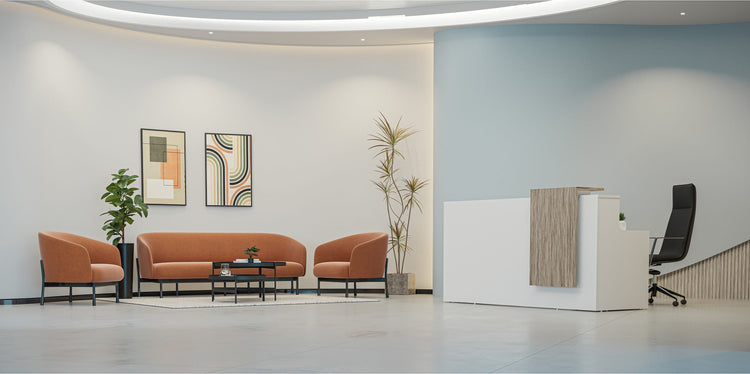 Reception counter and lounge seating in a furnished reception area