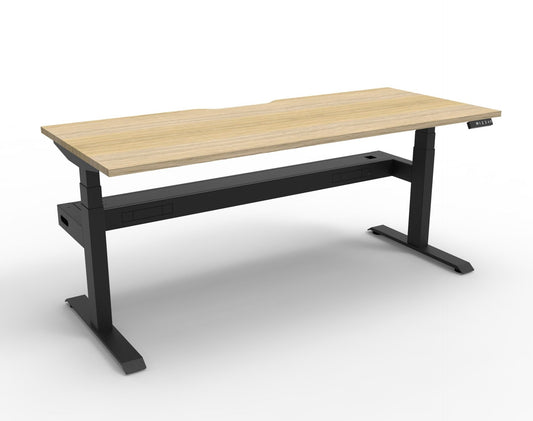 Boost+ electric single desk, Natural Oak / Black Satin, without screen, with cable tray. Representative image; proportions vary by size.